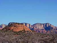 the butte of Robbers Roost, the cave is located on the opposite side